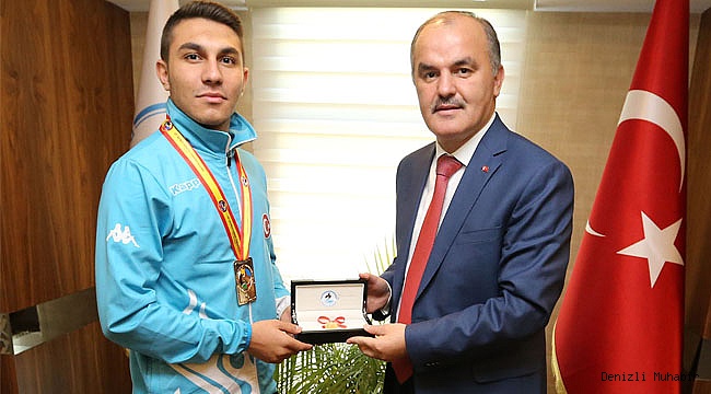 BAŞKAN GÜRLESİN, DÜNYA  ŞAMPİYONUNU AĞIRLADI