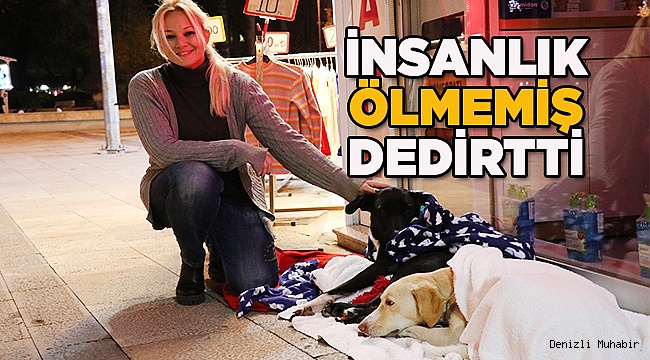Hayvanlar üşümesin diye mağazasının önüne battaniye serdi