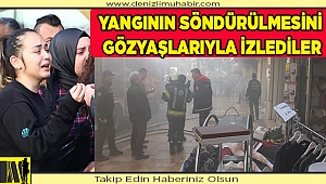 Çalıştıkları giyim mağazasındaki yangının söndürülmesini gözyaşlarıyla izlediler