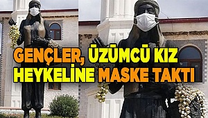 Gençler, üzümcü kız heykeline maske taktı