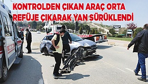 Kontrolden çıkan araç orta refüje çıkarak yan sürüklendi