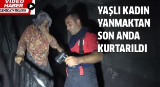 Binayı saran alevler arasında kalan yaşlı kadın dakikalar sonra kurtarıldı