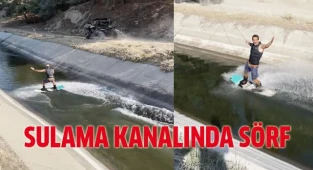 Sulama kanalında ATV ile sörf yaptı