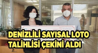 Rekor ikramiye kazanan talihli çekini teslim aldı