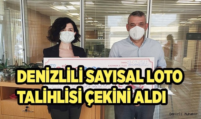 Rekor ikramiye kazanan talihli çekini teslim aldı
