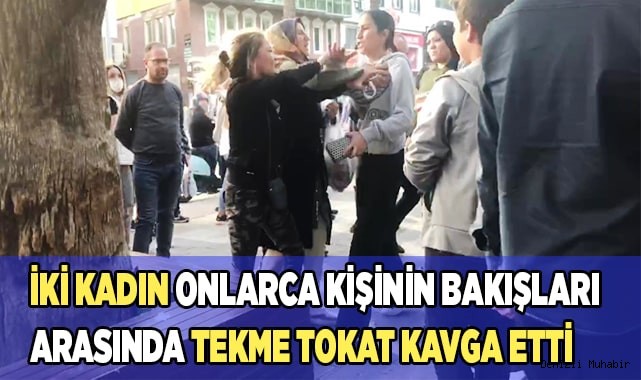 İki kadın onlarca kişinin bakışları arasında tekme tokat kavga etti