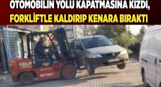 Otomobilin yolu kapatmasına kızdı, forkliftle kaldırıp kenara bıraktı