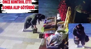 Torbasının arkasına saklayarak götürdü