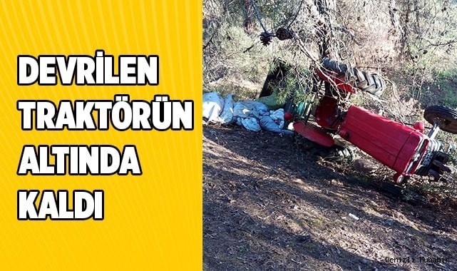 Devrilen traktörün altında kaldı