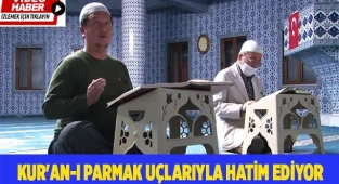 Göremediği Kur'an-ı parmak uçlarıyla okuyup hatim ediyor