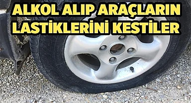 Alkol alıp sokaktaki araçların lastiklerini kestiler
