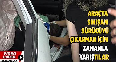 Araçta sıkışan sürücüyü çıkarmak için zamanla yarıştılar