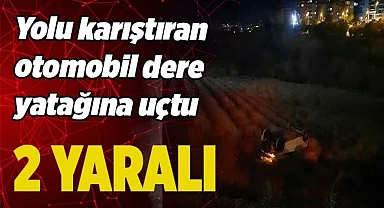 Yolu karıştıran otomobil dere yatağına uçtu; 2 yaralı