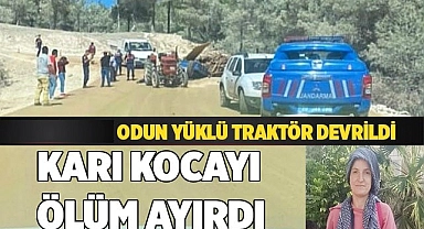 Devrilen odun yüklü traktör, karı kocayı ayırdı