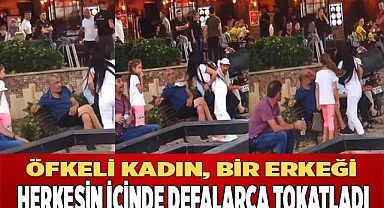 Öfkeli kadın, bir erkeği herkesin içinde defalarca tokatladı