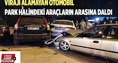 Virajı alamayan otomobil park halindeki araçların arasına daldı