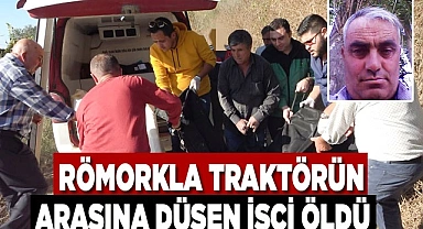 Römorkla traktörün arasında yolculuk eden işçi öldü