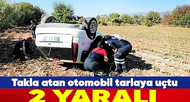 Takla atan otomobil tarlaya uçtu: 2 yaralı