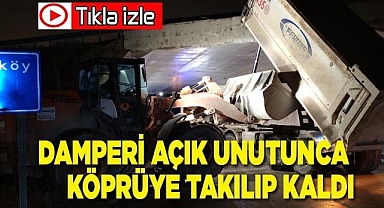 Damperi açık unutunca köprüye takılıp kaldı