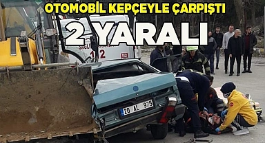 Kepçe ile çarpışan otomobil hurdaya döndü: 2 yaralı