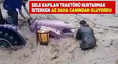 Sele kapılan traktörü kurtarmak isterken az daha canından oluyordu