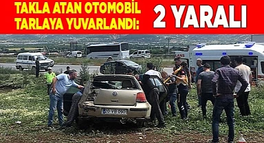 Takla atan otomobil tarlaya yuvarlandı: 2 yaralı