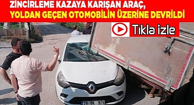 Zincirleme kazaya karışan araç, yoldan geçen otomobilin üzerine devrildi