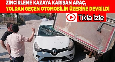 Zincirleme kazaya karışan araç, yoldan geçen otomobilin üzerine devrildi