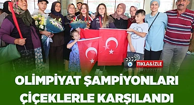 OLİMPİYAT ŞAMPİYONLARI ÇİÇEKLERLE KARŞILANDI